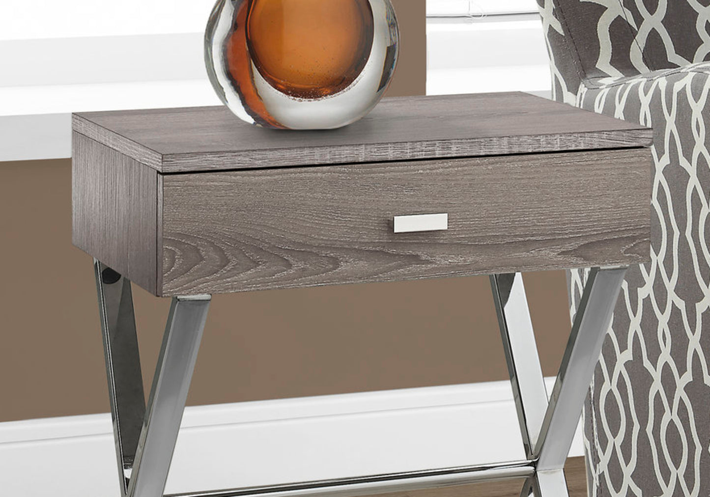 Modern grey wood end table with a silver drawer pull and chrome legs