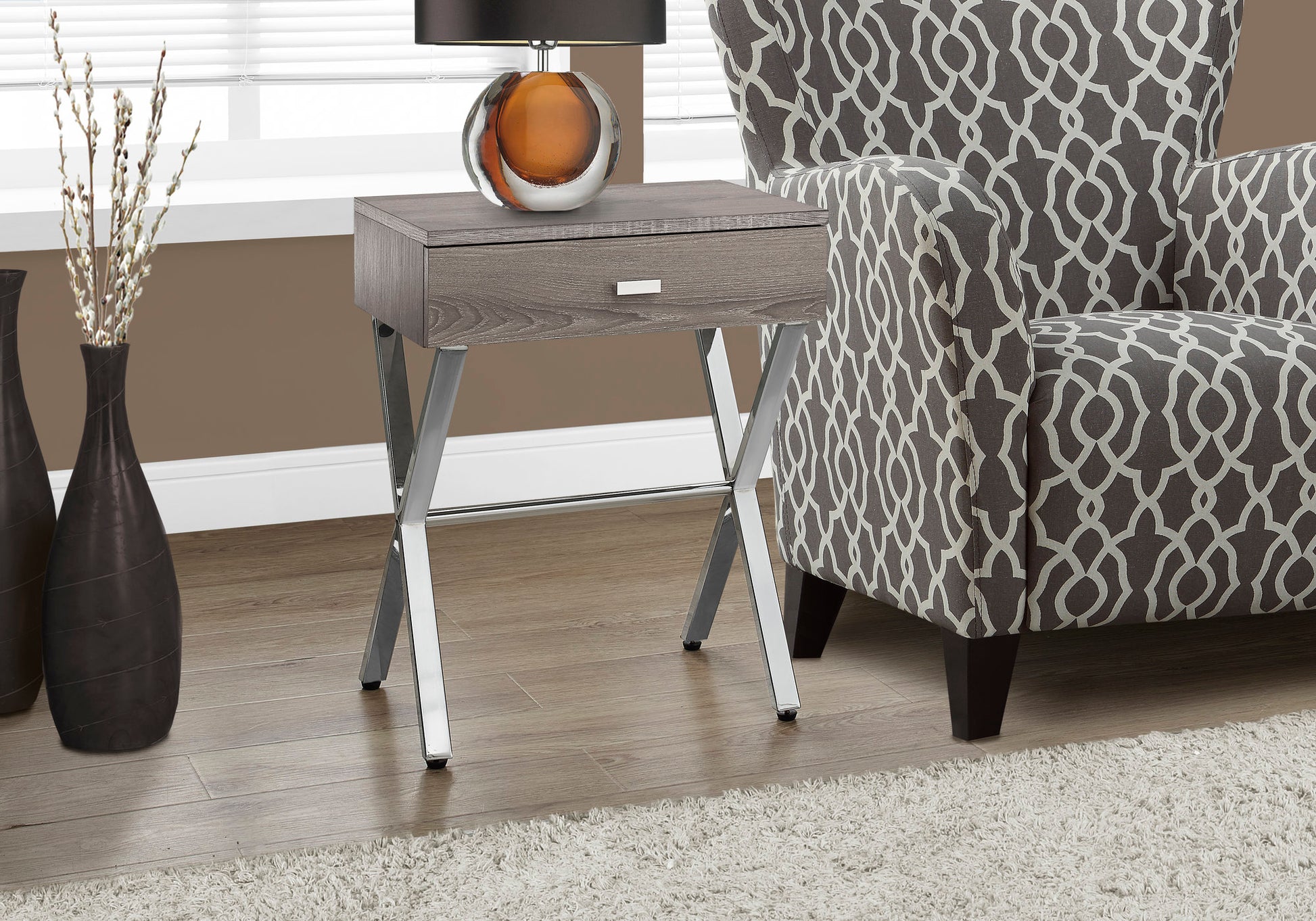 Gray wood grain end table with a chrome frame and single drawer perfect for living rooms