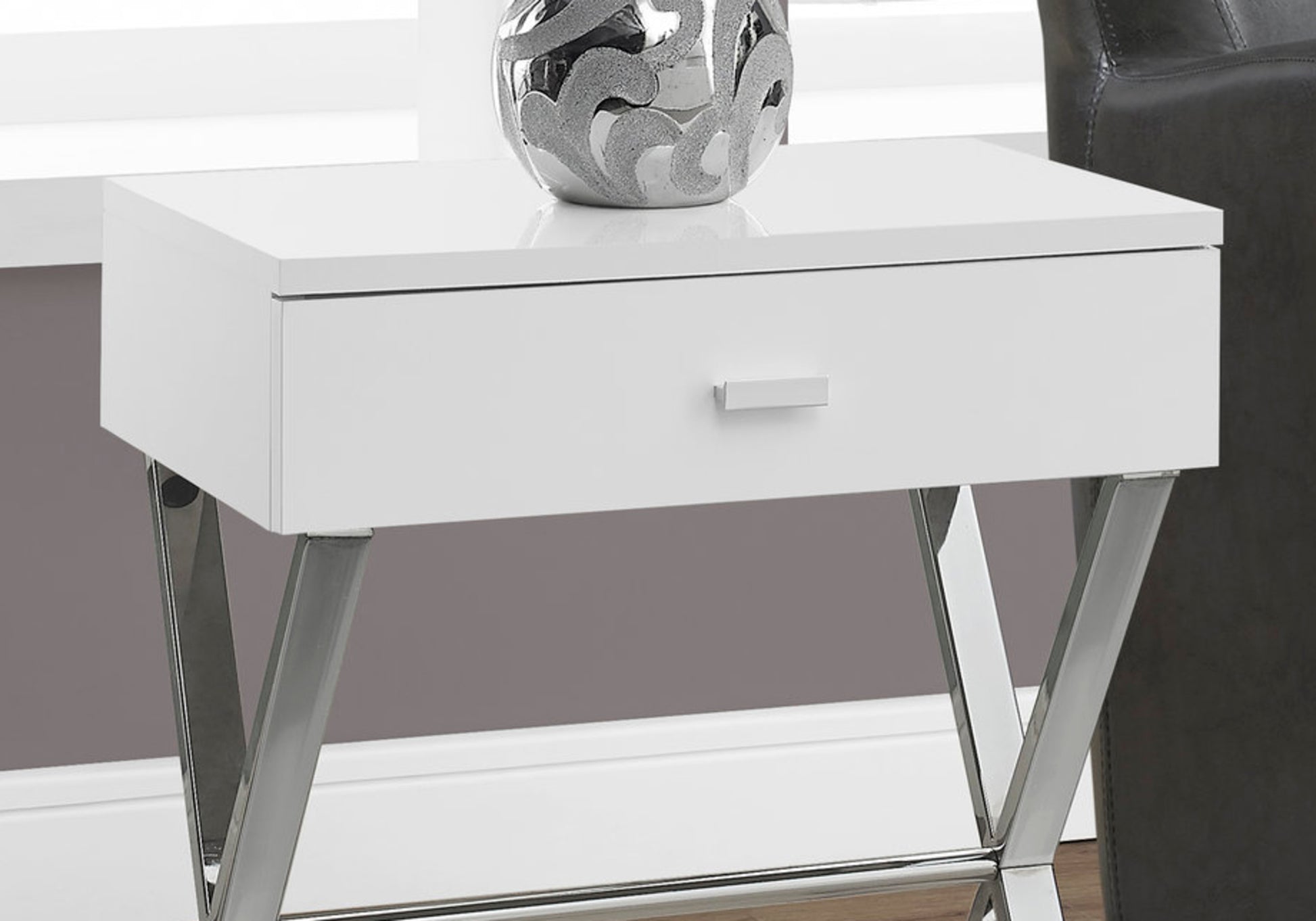 Sleek white end table with a single drawer and polished chrome Vshaped legs for modern living room decor