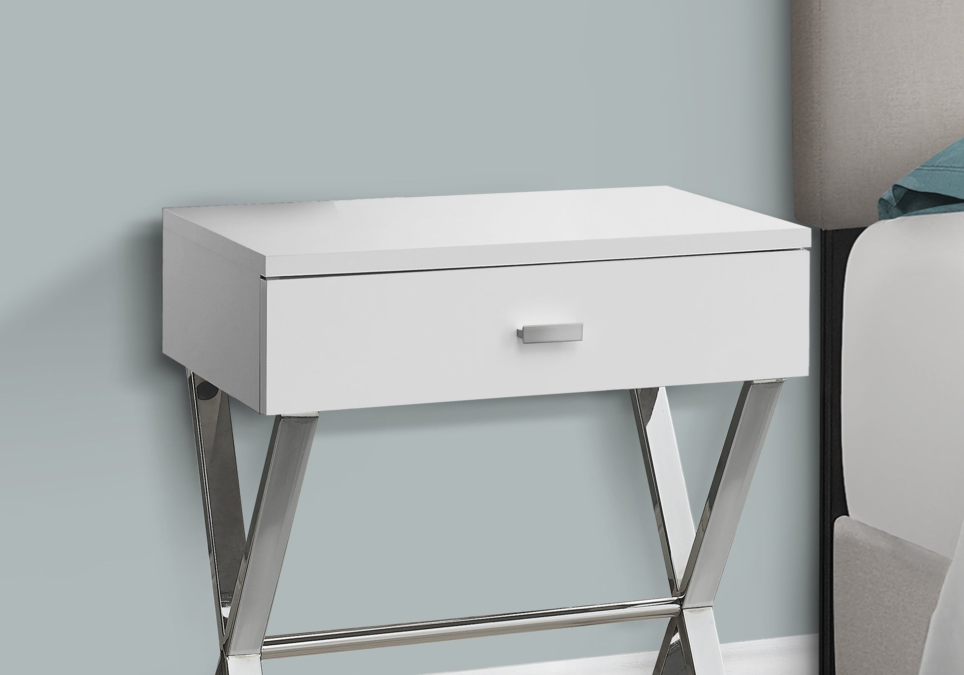 Modern white nightstand with polished chrome legs and a single drawer