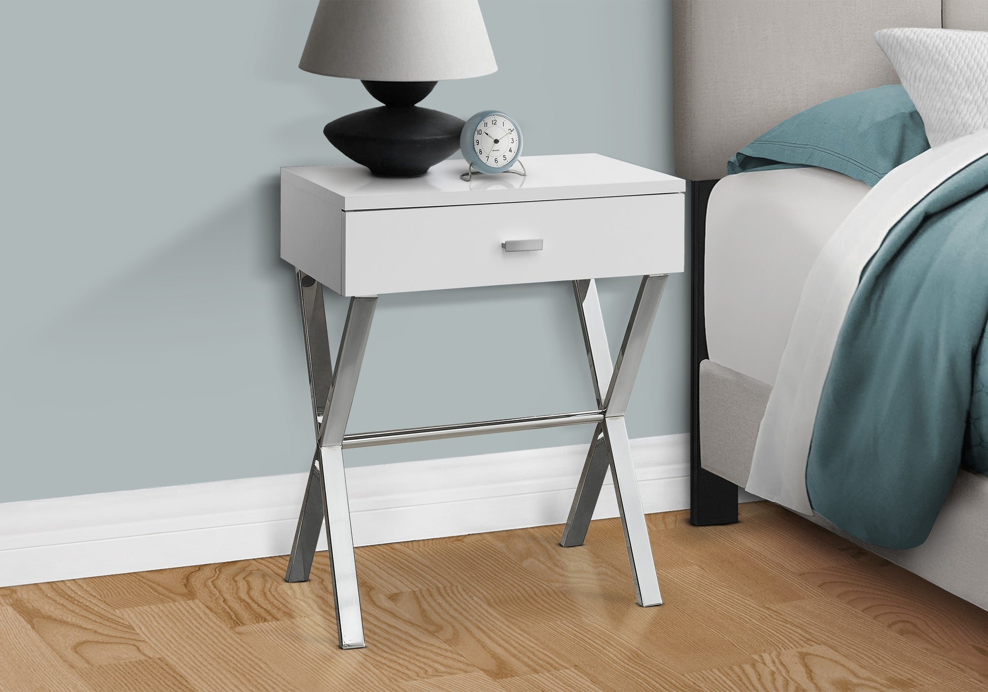 Sleek white nightstand with chrome Xframe legs and a single drawer perfect for modern bedrooms