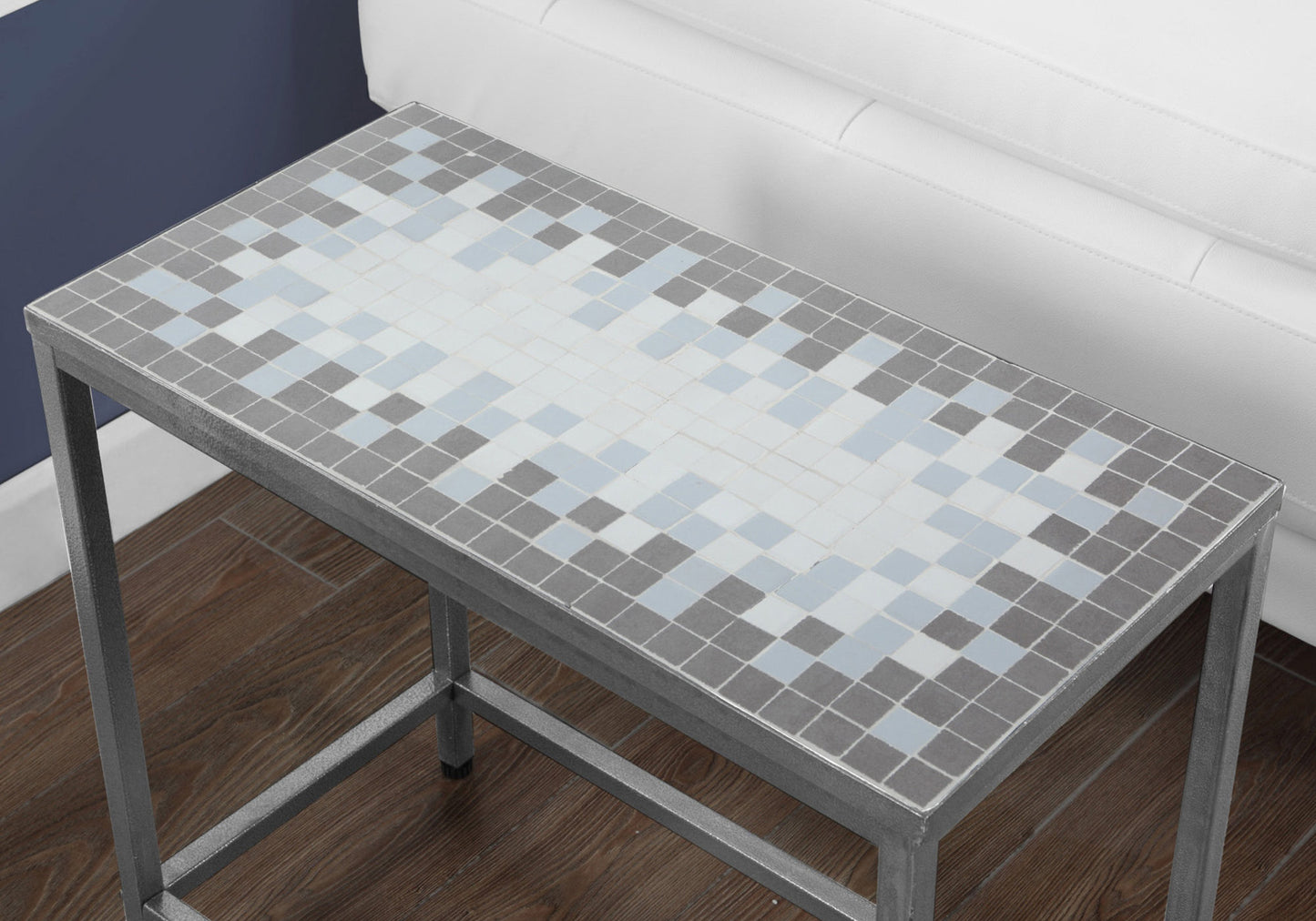 Rectangular metal side table with a grey and light blue mosaic tiled top
