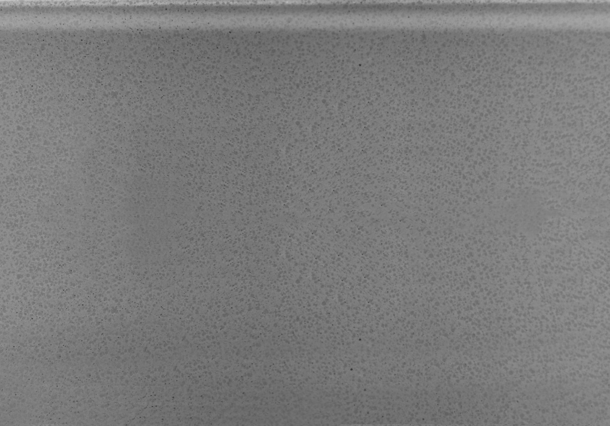 Textured grey countertop sample with speckled finish suitable for kitchens