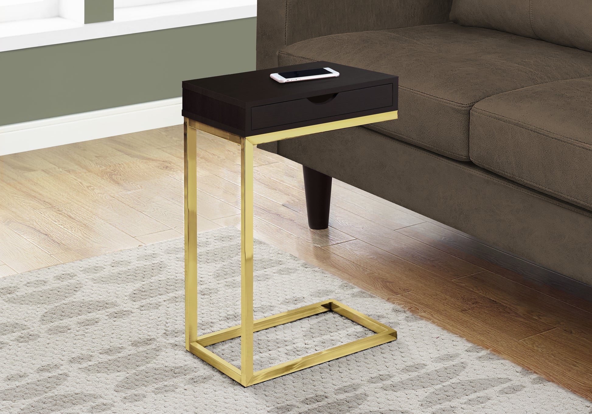 Dark brown ctable with gold metal frame and single drawer phone on top