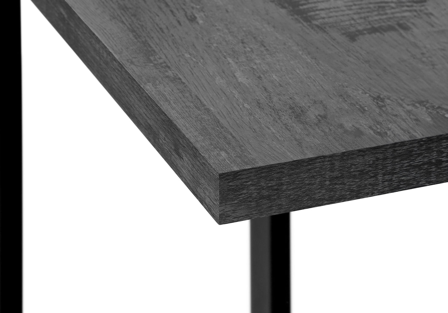 Dark grey wood grain desktop detail with black metal leg support