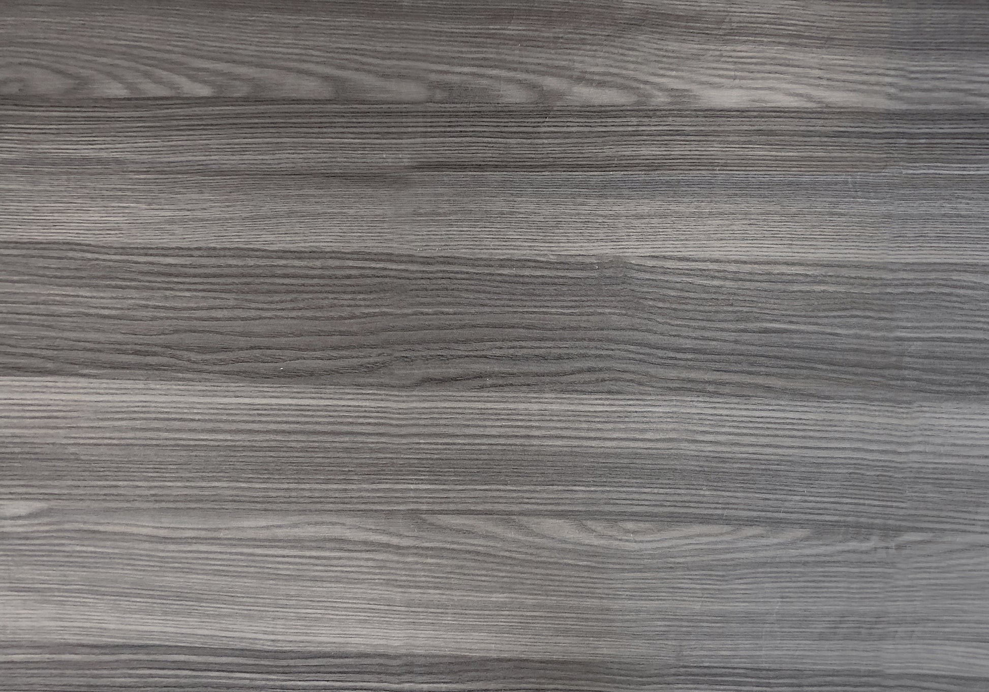 Distressed grey wood plank texture with horizontal grain ideal for flooring