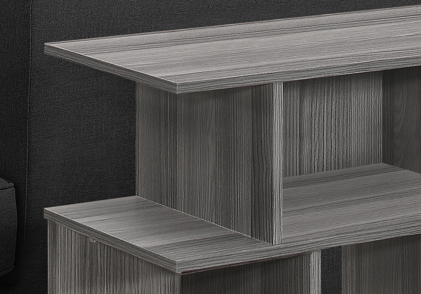 Gray wood grain end table with open shelving  characters