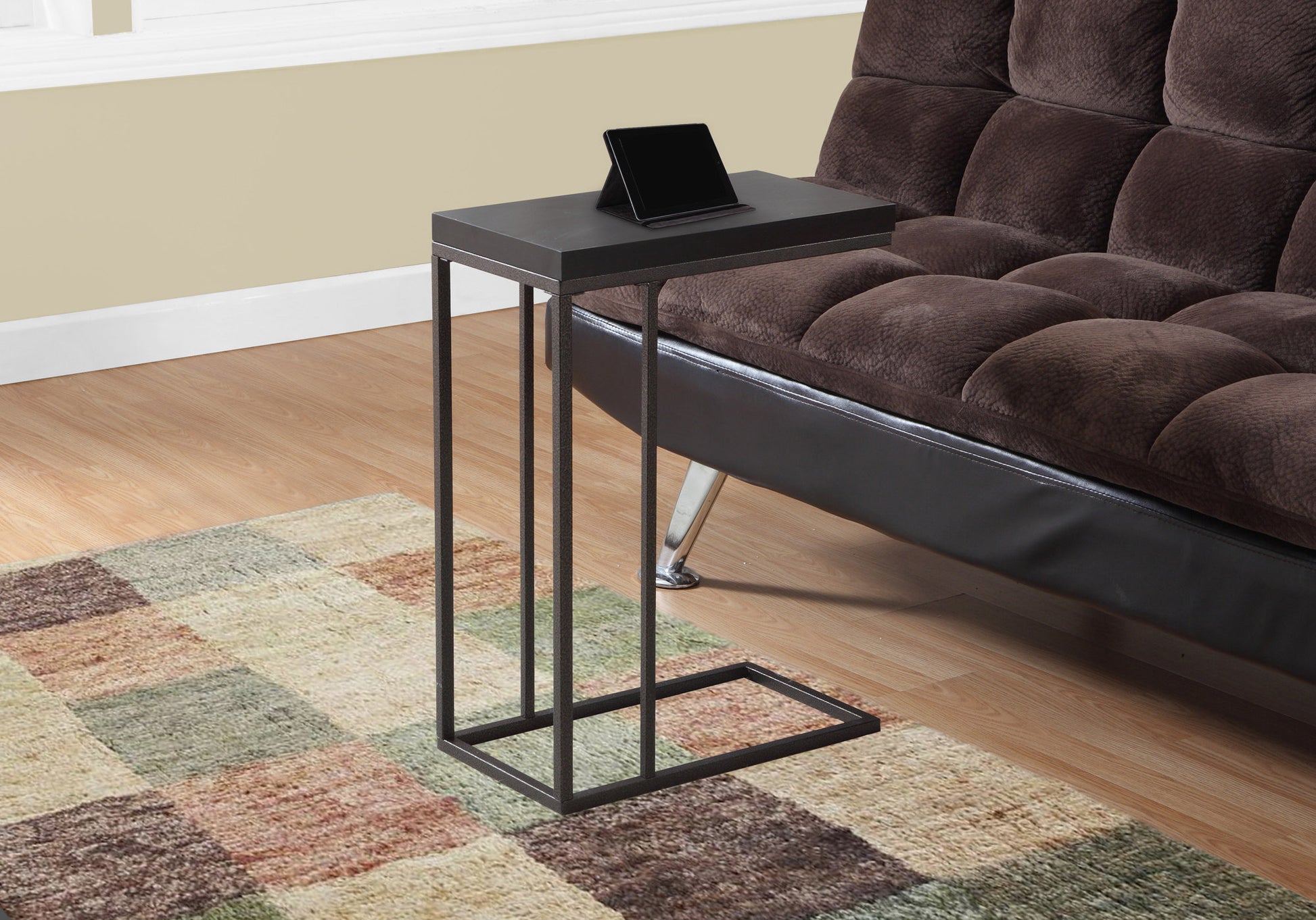 Dark grey Ctable with metal frame and a tablet stand on top ideal for living room