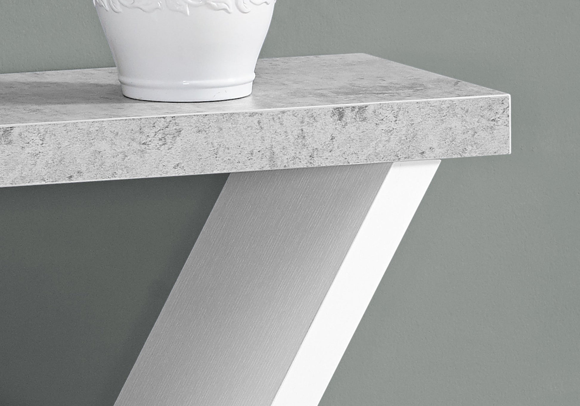 Modern grey concrete effect console table top with textured white ceramic vase accent