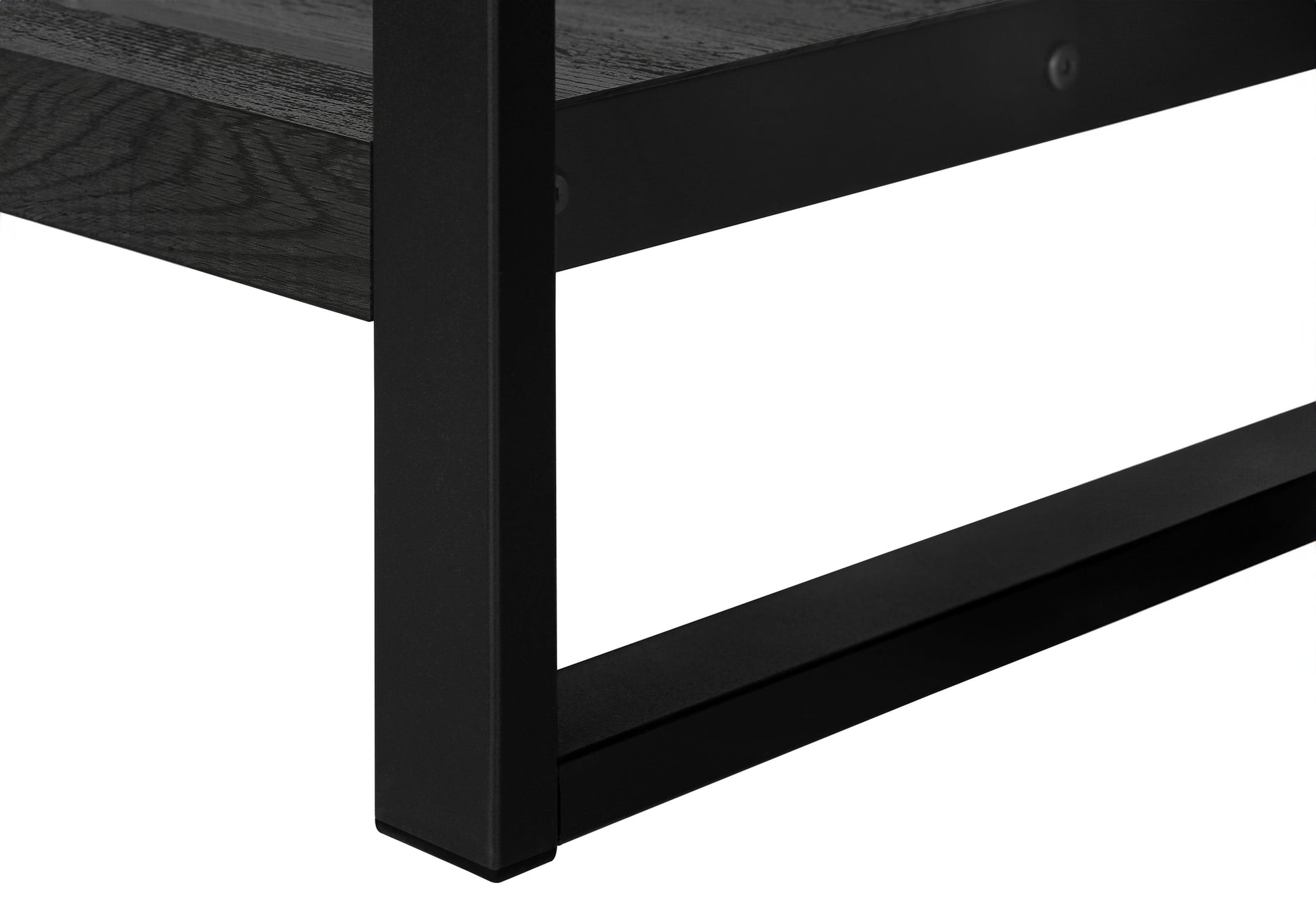 Black metal frame and dark wood shelf detail of a modern coffee table