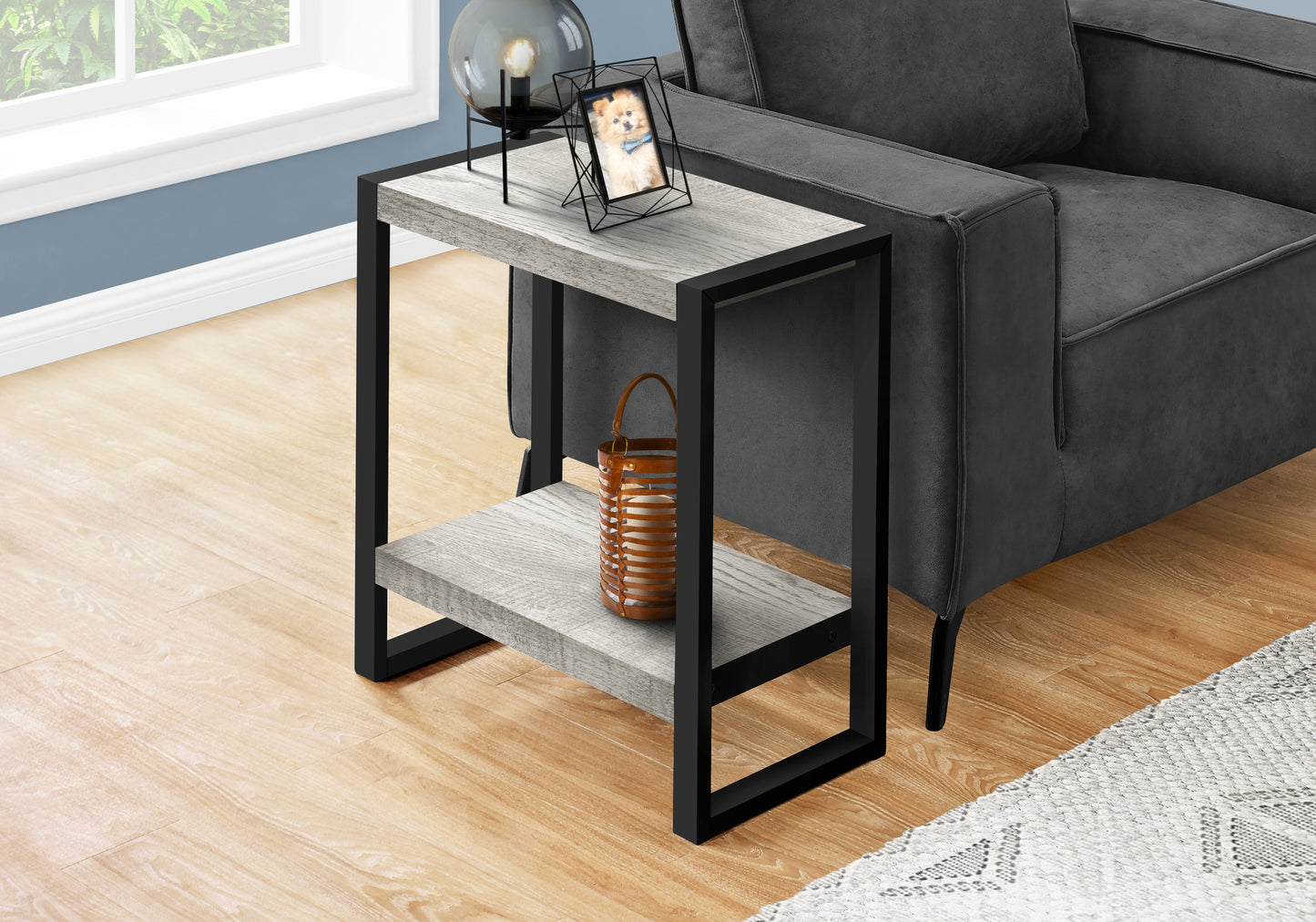 Industrial style end table with rustic gray wood finish and black metal frame