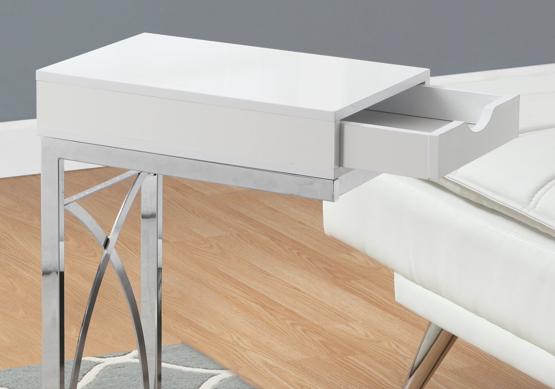 White high gloss ctable with open drawer and chrome legs
