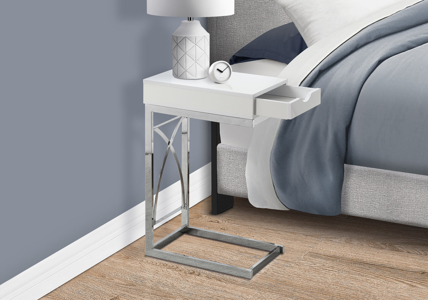 Sleek white Ctable with a chrome base perfect for bedside convenience