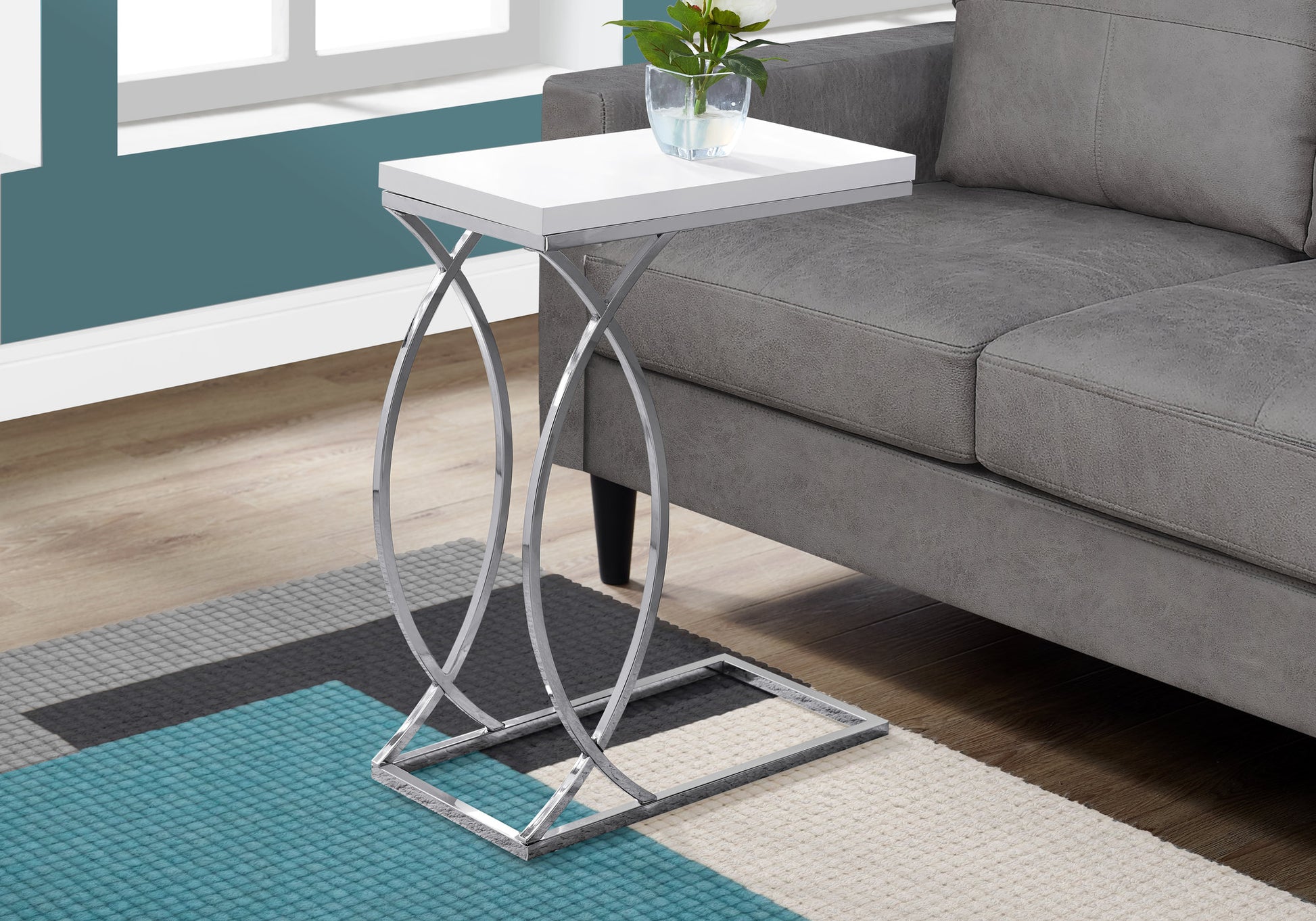 Modern white ctable with chrome base perfect for living room use