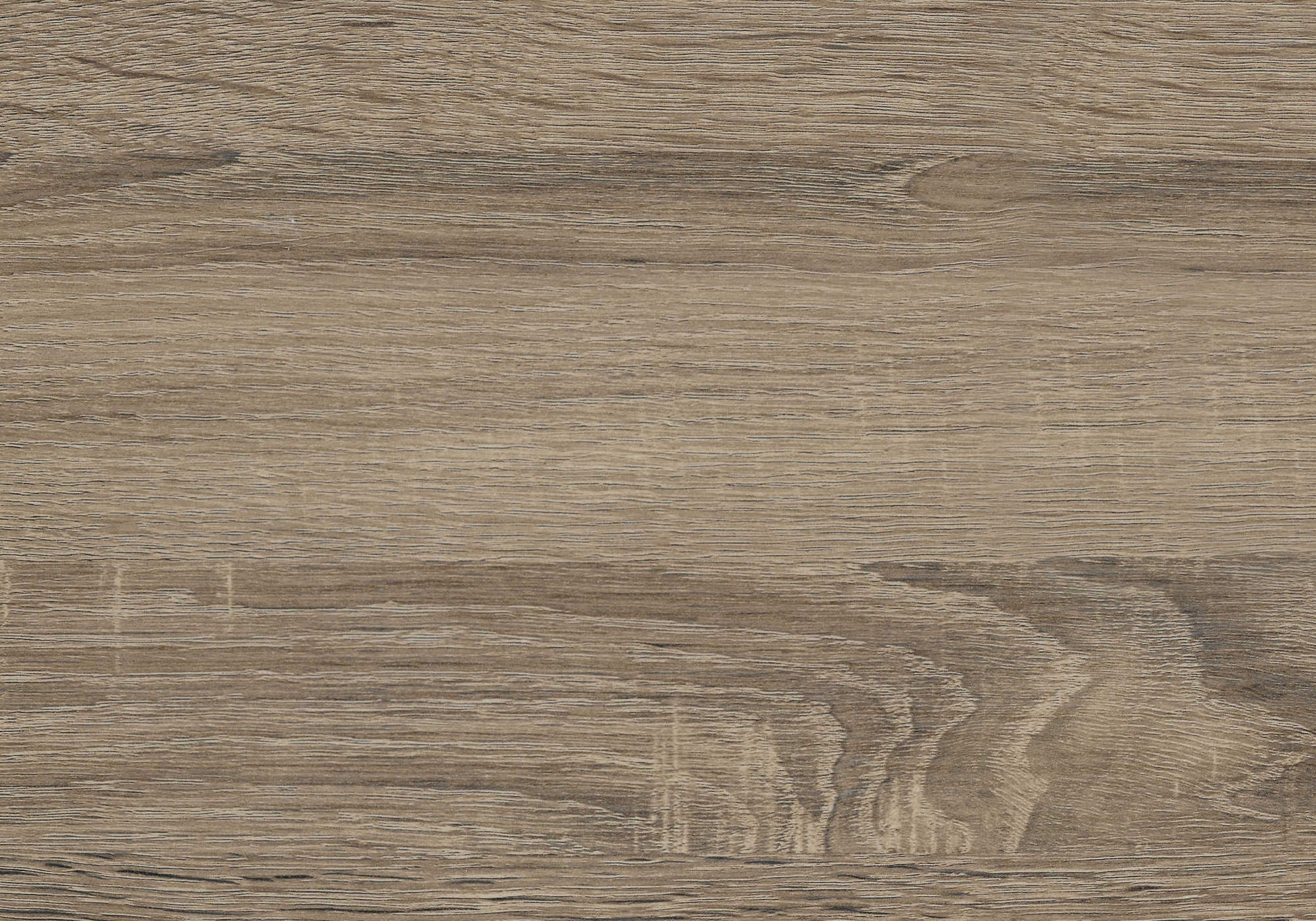 Closeup of taupe wood grain laminate flooring with distinct lines and subtle knots