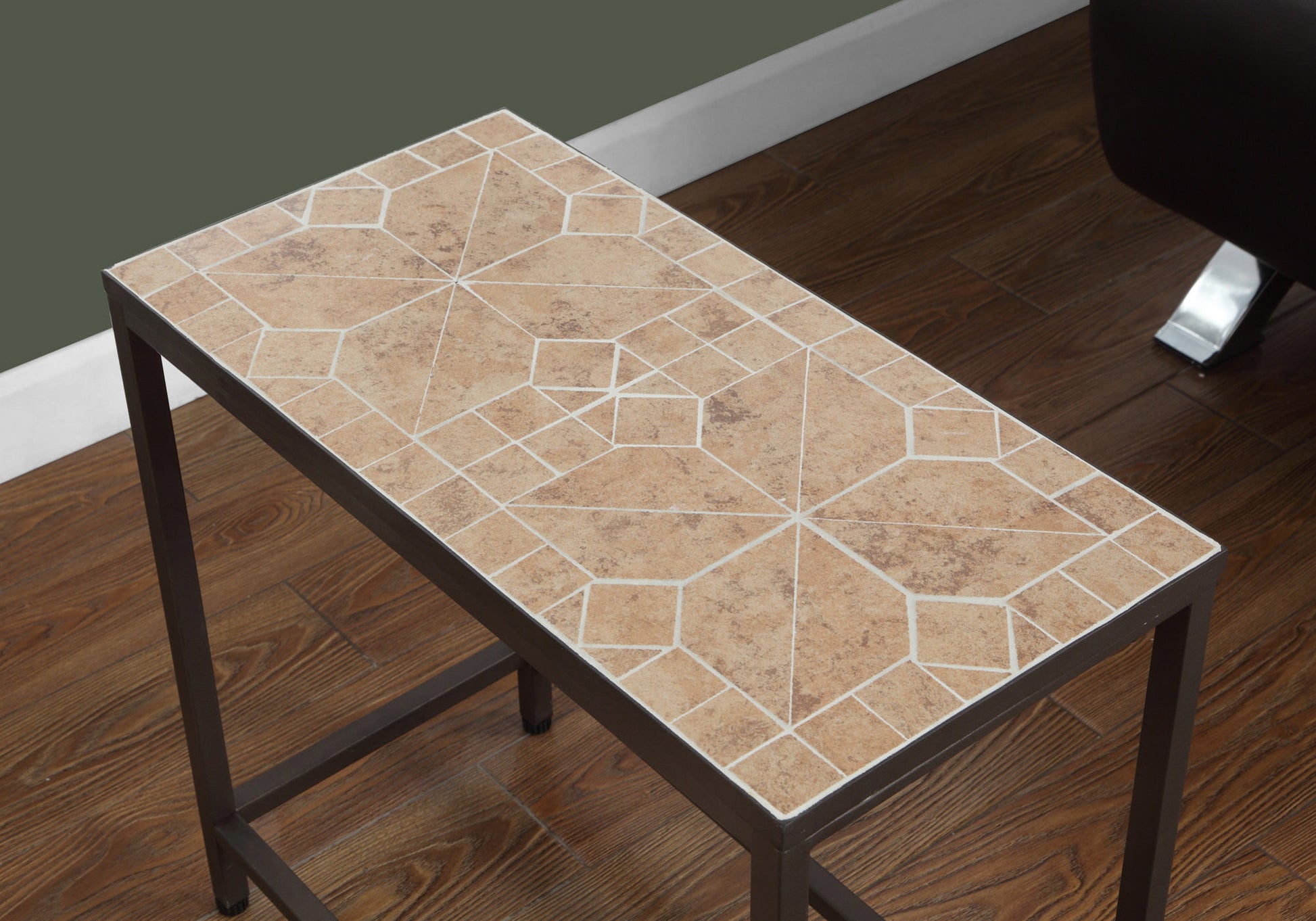 Rectangular end table with a brown metal frame and a mosaic tile top featuring geometric patterns in tan and cream