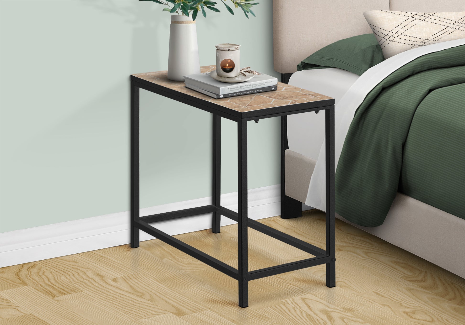 Slim black metal end table with faux stone top ideal for small spaces