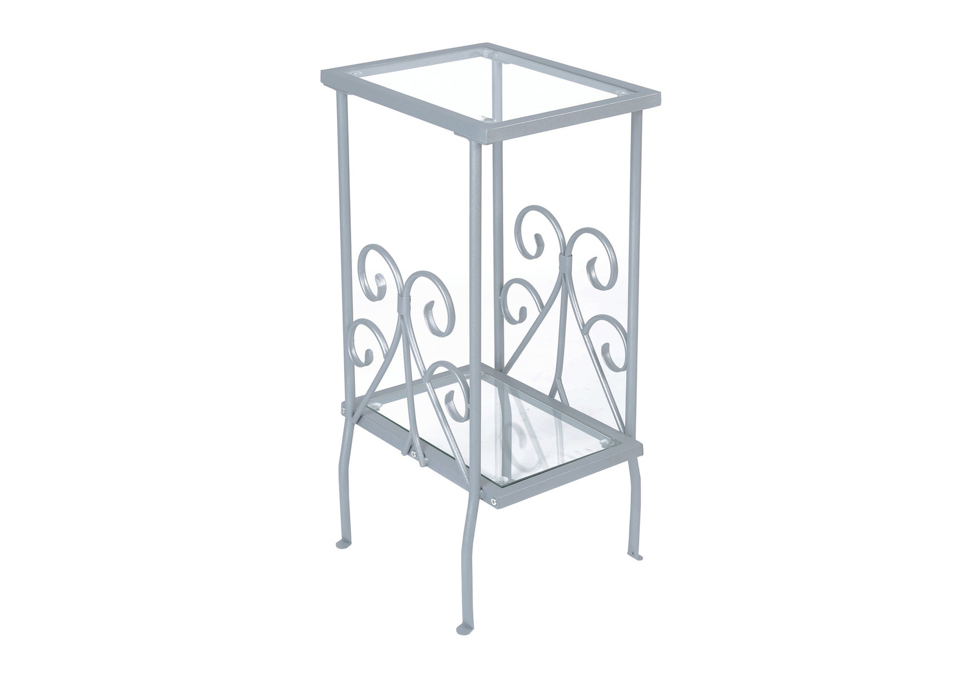Silver metal plant stand with glass shelves and ornate scrollwork