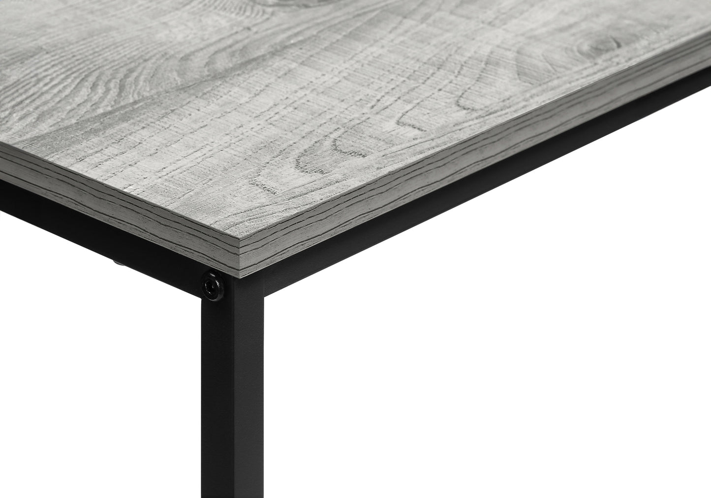 Closeup of distressed gray wood grain tabletop with black metal leg attachment