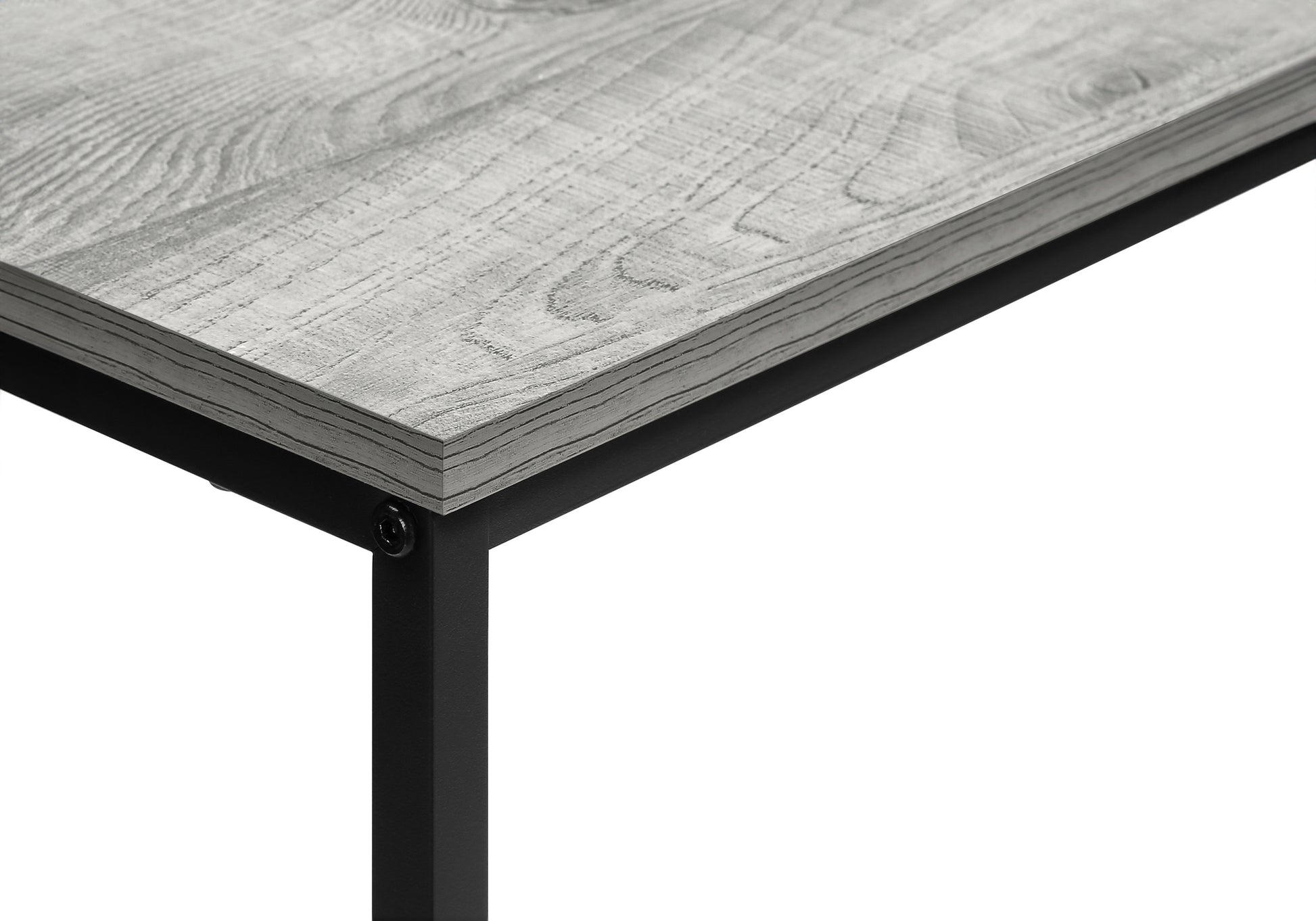 Closeup of distressed gray wood grain tabletop with black metal leg attachment