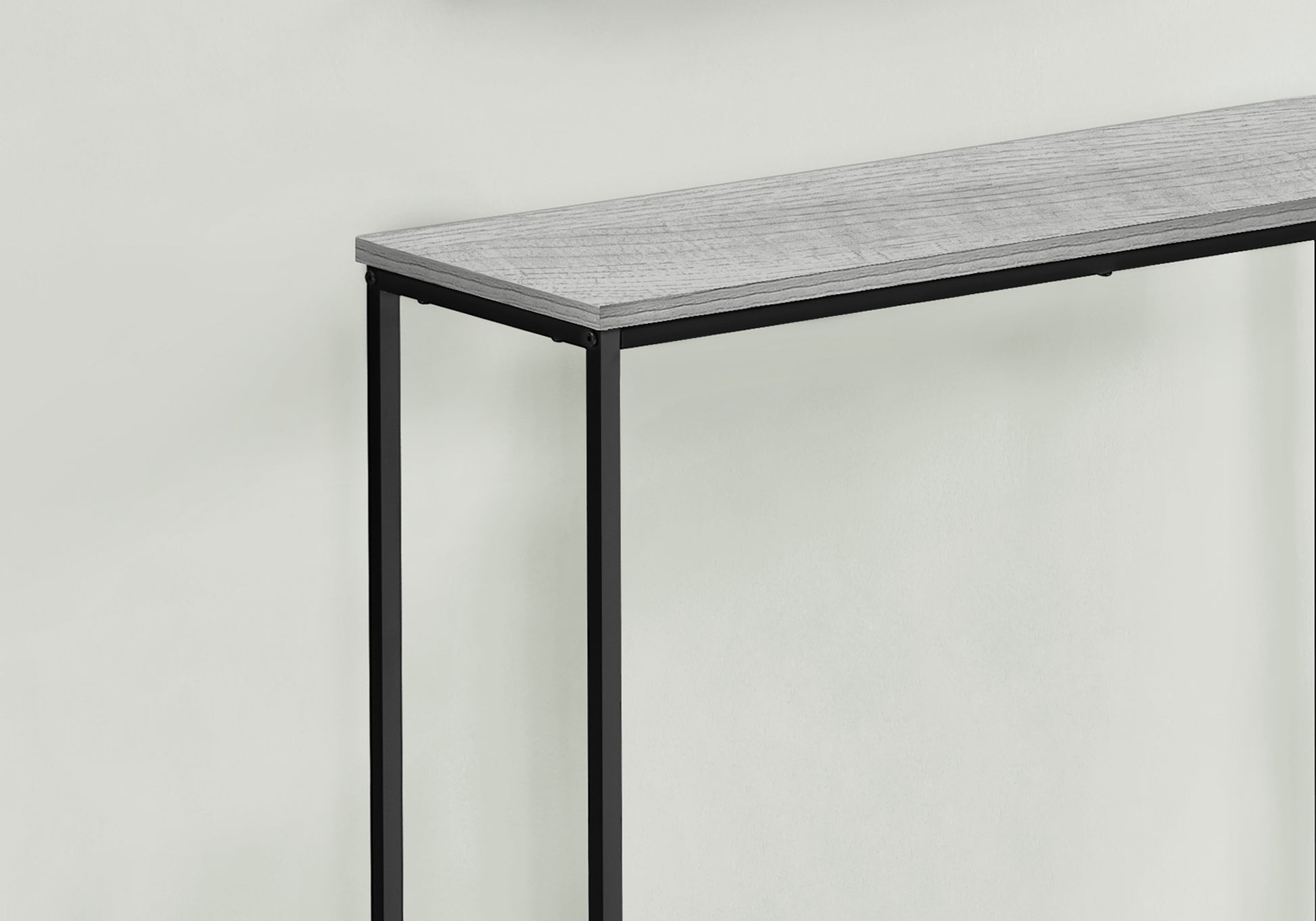 Slim grey wood top console table with black metal legs
