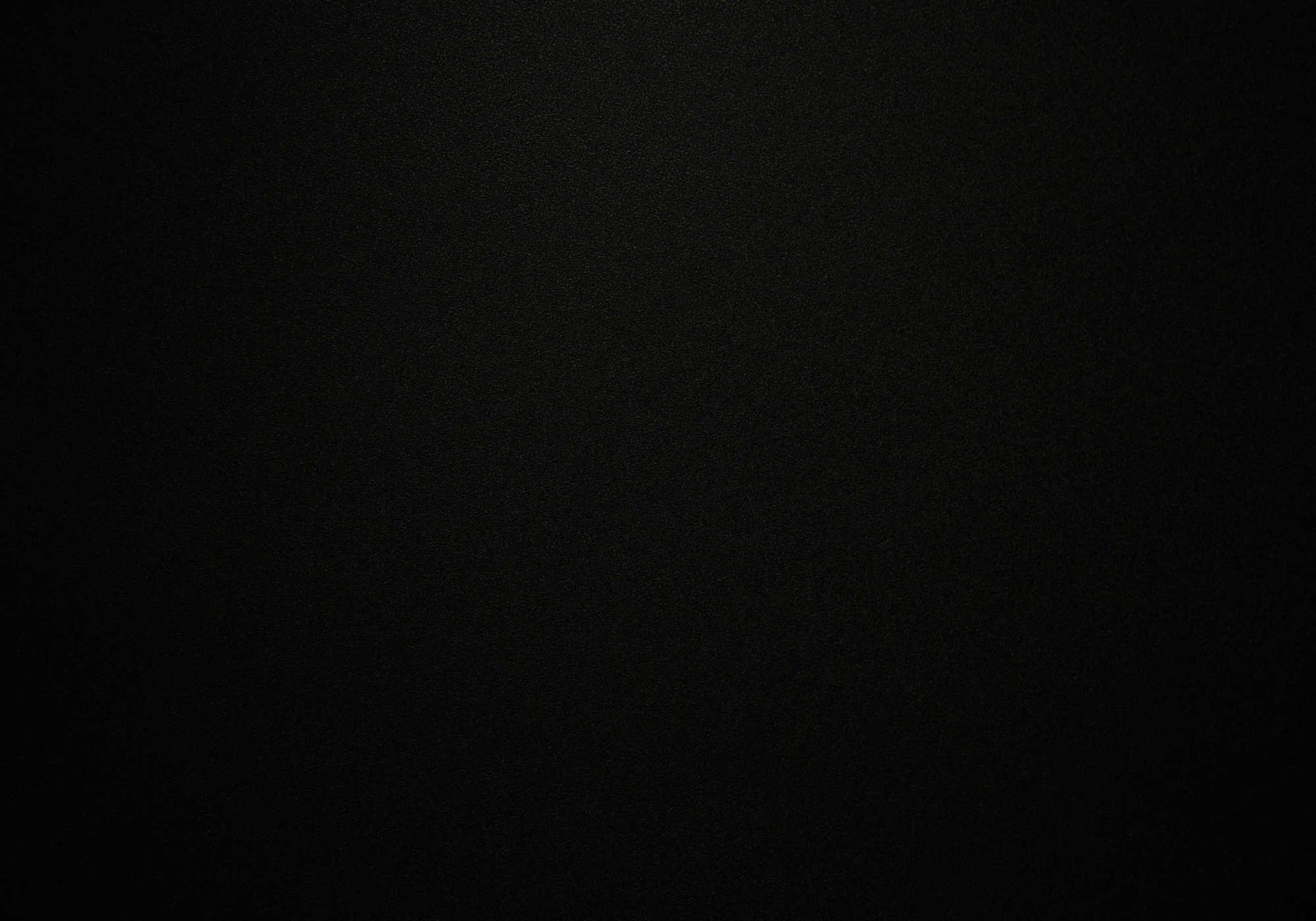 Black textured wallpaper creating a sophisticated and modern backdrop for home decor