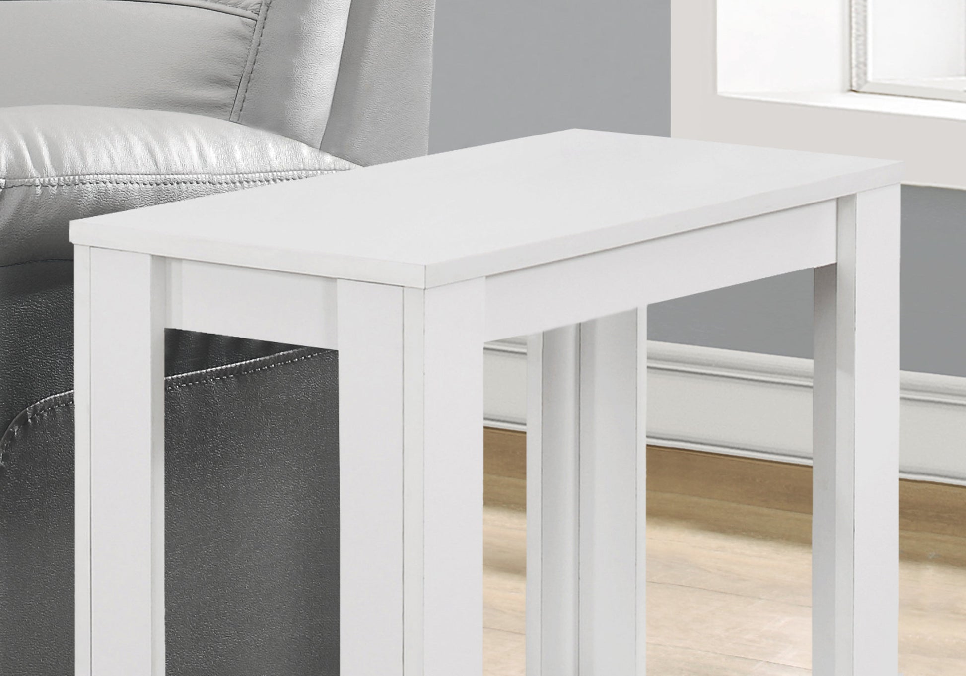Sleek white Ctable perfect accent furniture for tight spaces next to a couch