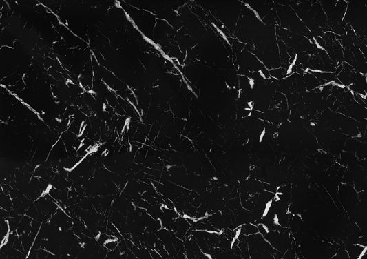 Elegant black marble slab with white veining ideal for countertops