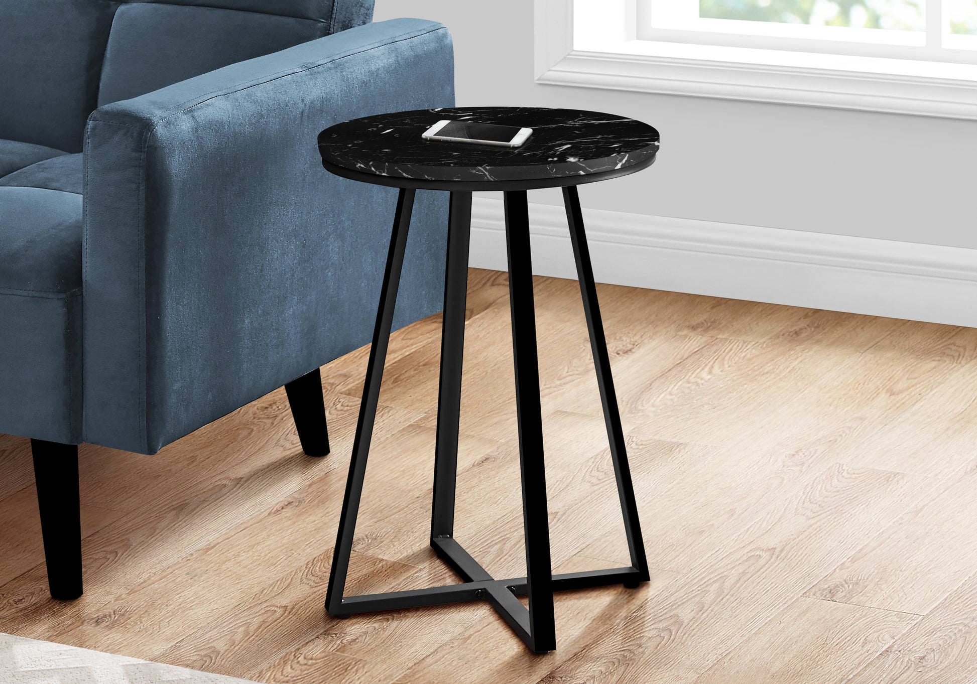 Round black marble top end table with a modern Xbase for living rooms