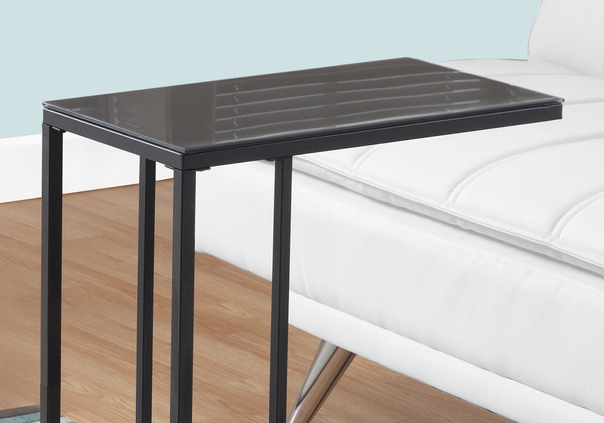 Black metal Ctable with a smoked glass top perfect for bedside use