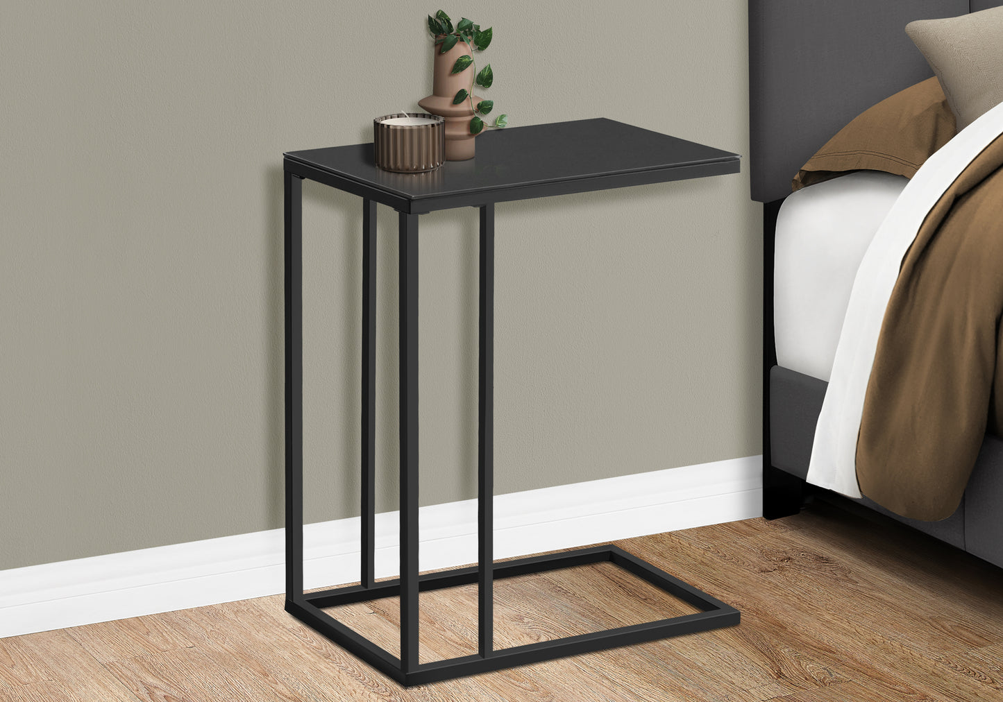 Sleek black metal Ctable with a thin rectangular top perfect for bedside use