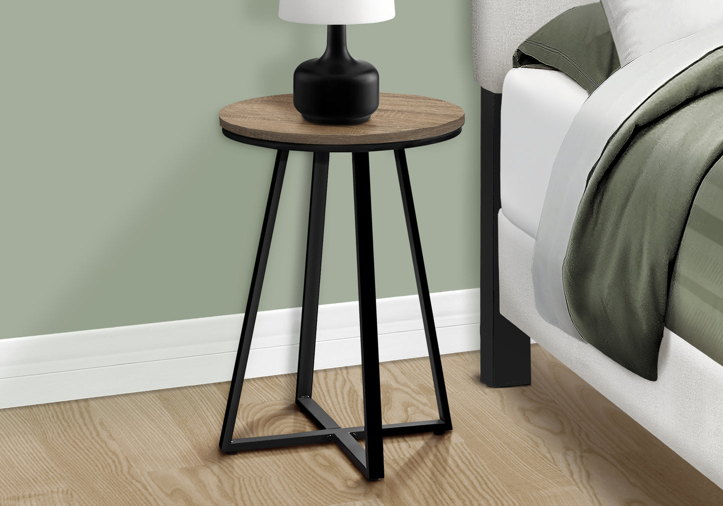 Round wood top side table with black metal frame perfect for bedside use