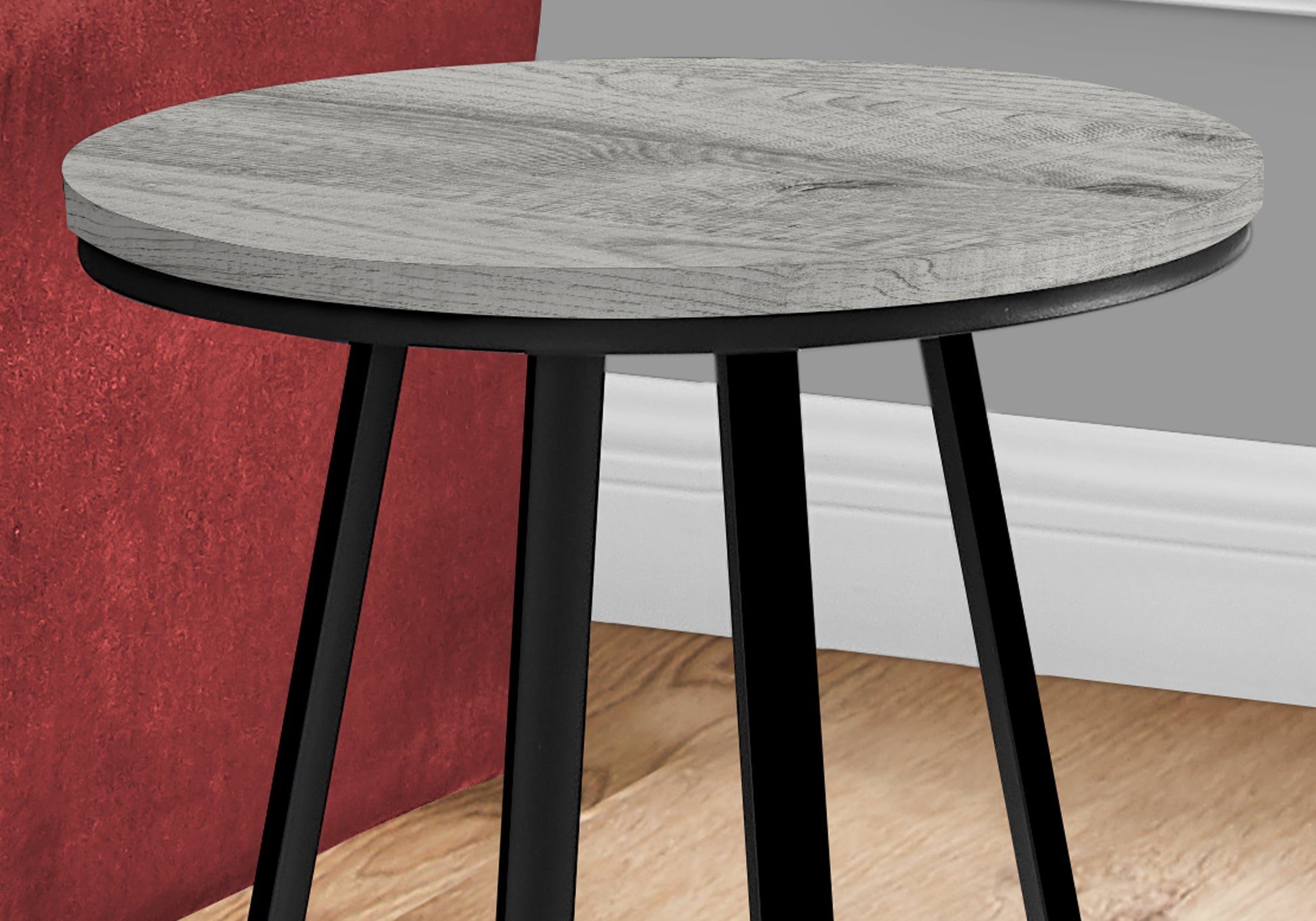 Round side table with distressed grey woodlook top and black metal legs
