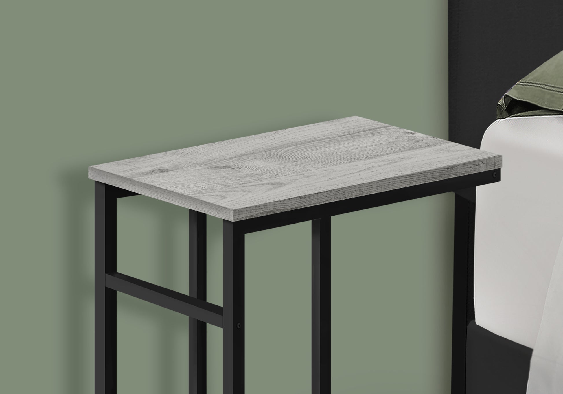 Grey woodgrain end table with black metal frame for bedside use