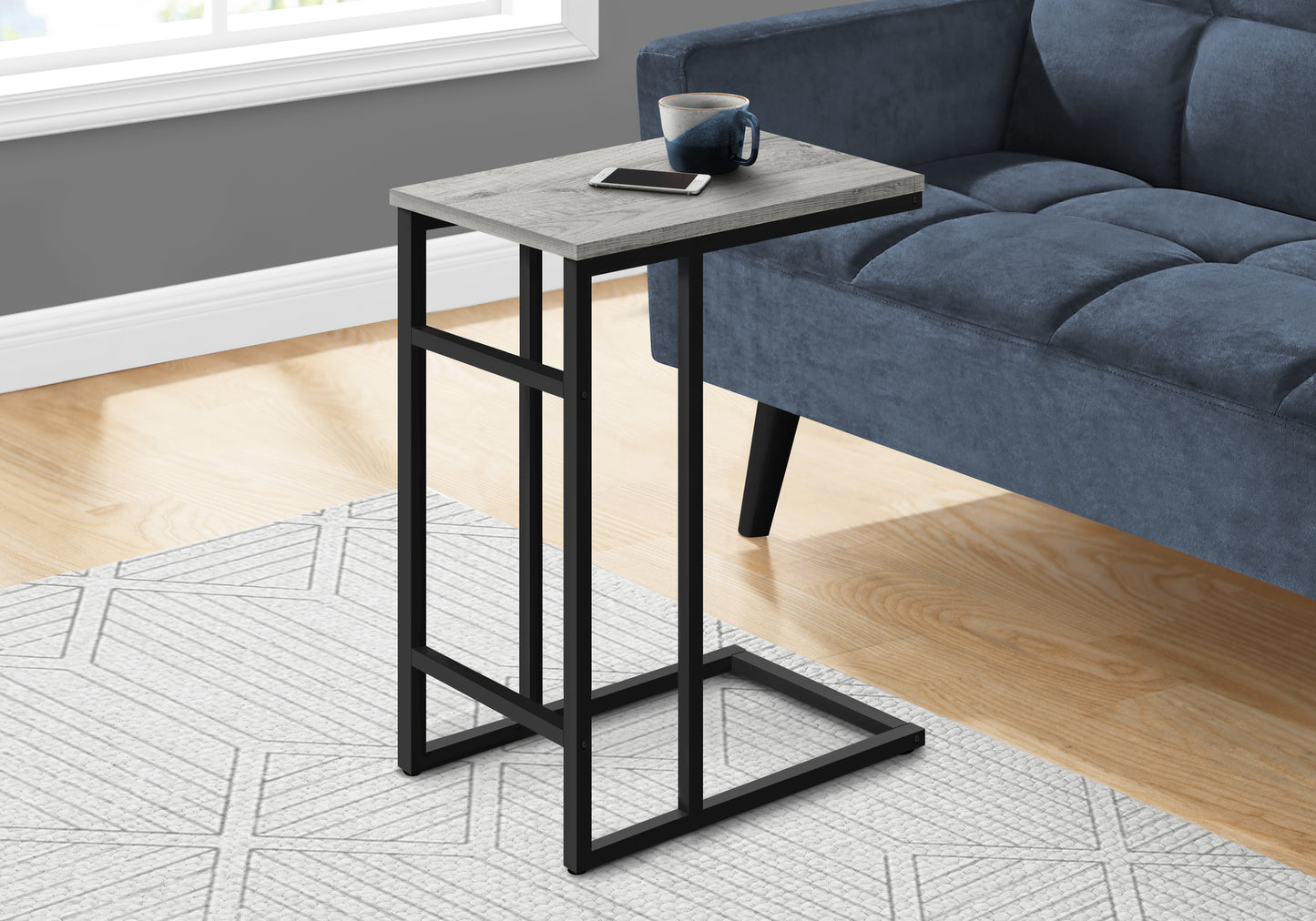 Modern ctable with distressed wood finish and black metal frame