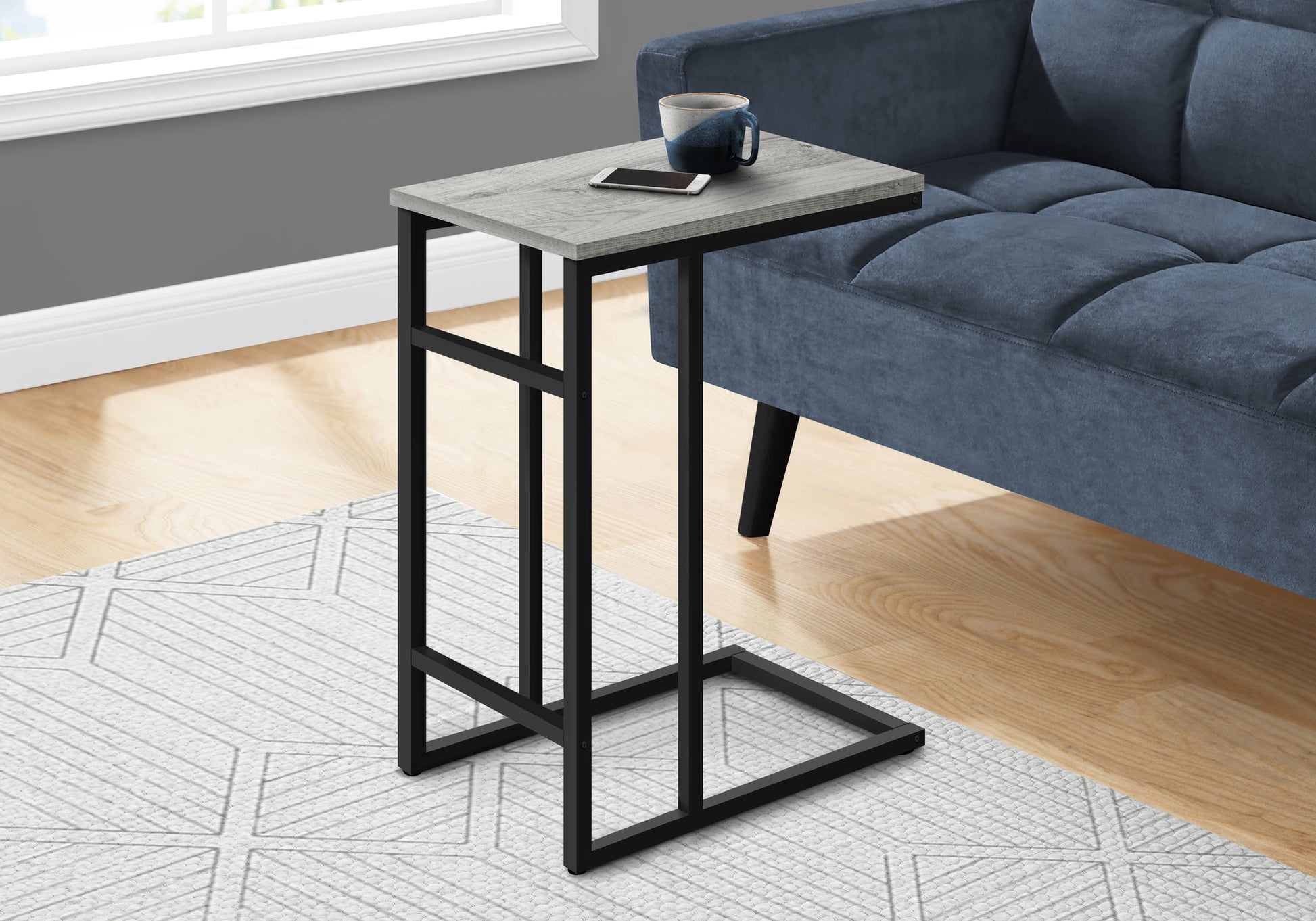 Modern ctable with distressed wood finish and black metal frame