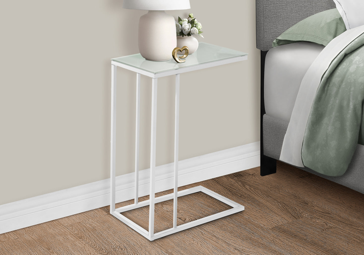 White metal ctable with clear glass top and gold heart accent