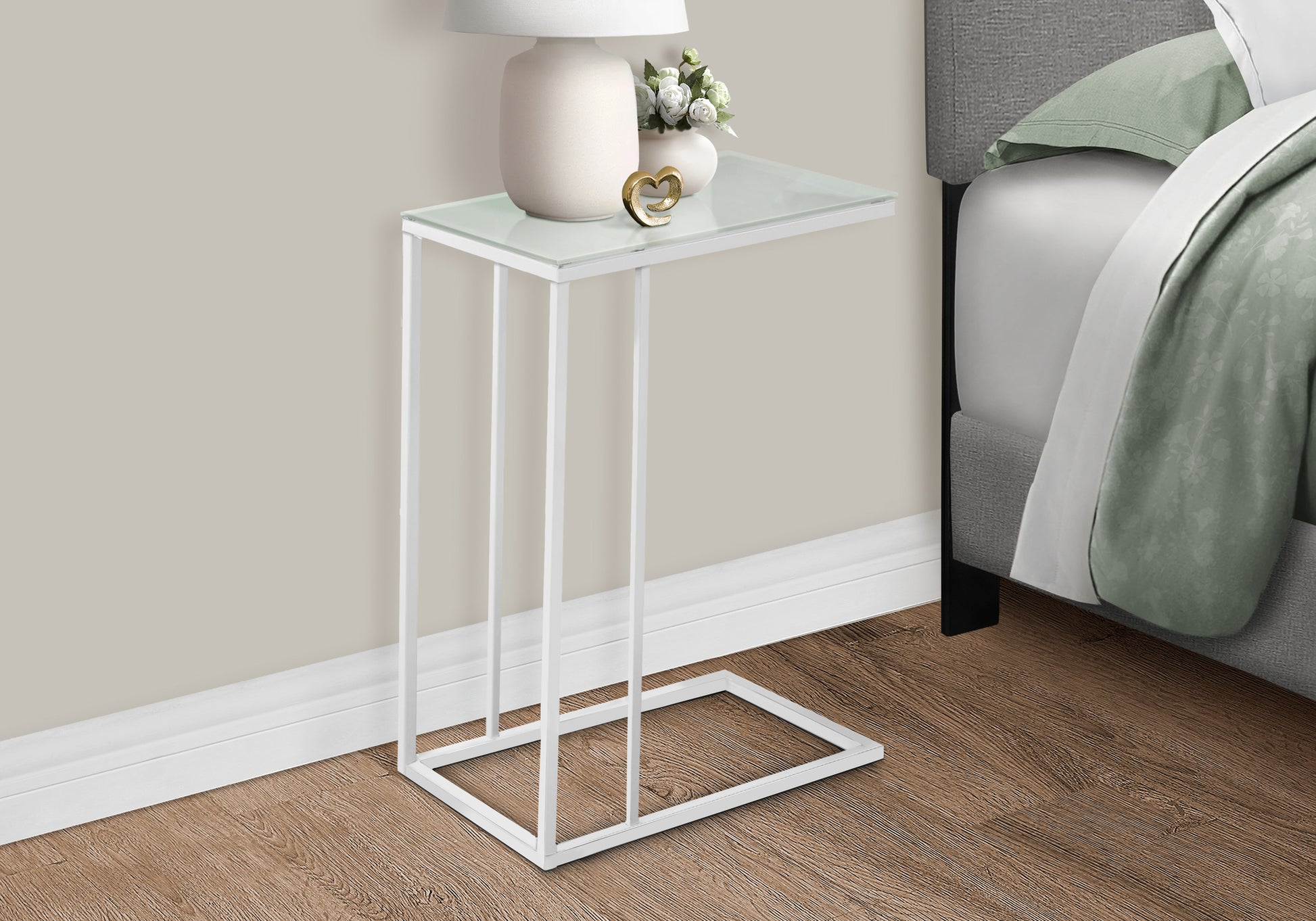 White metal ctable with clear glass top and gold heart accent