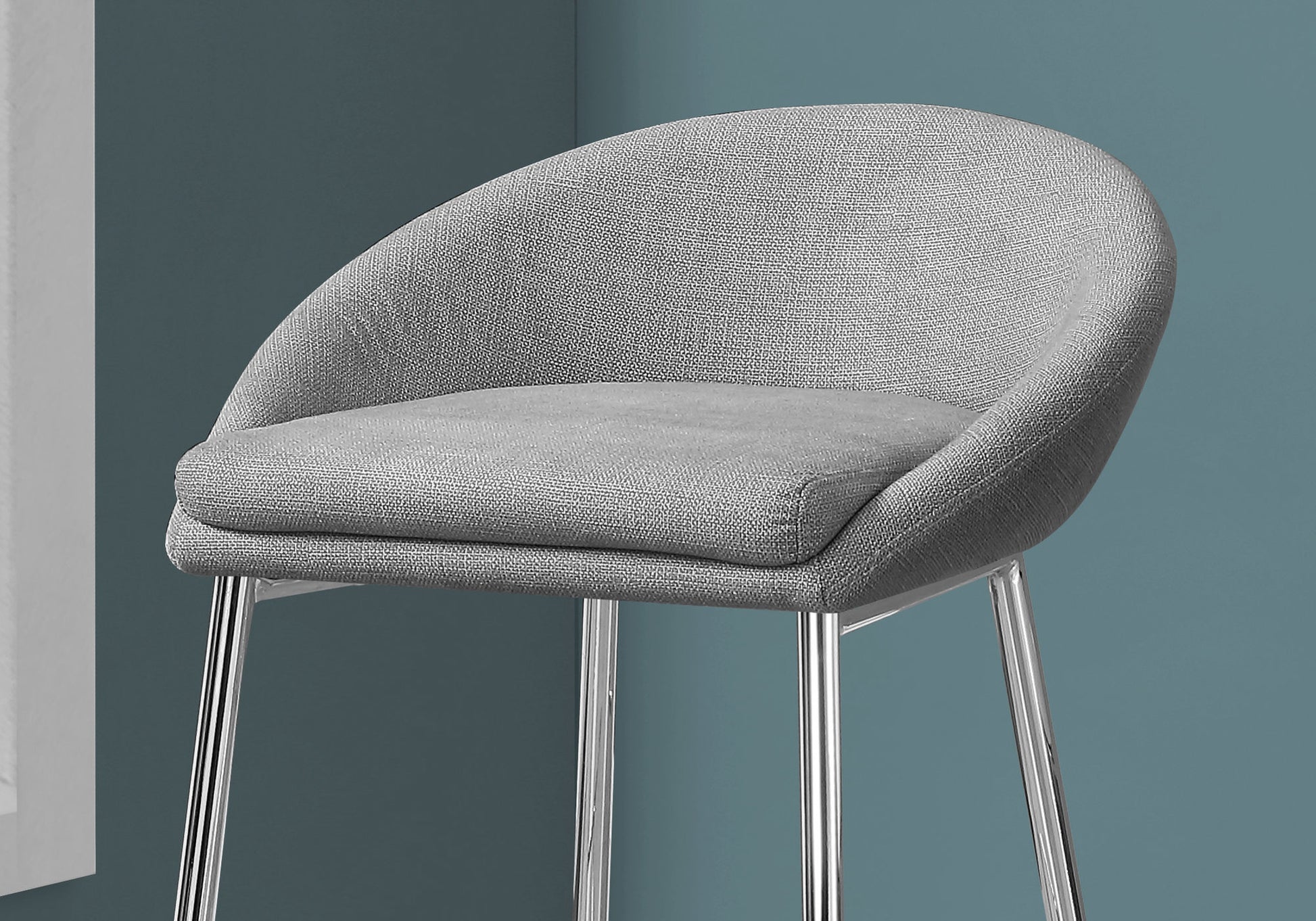 Gray upholstered bar stool with a rounded back and sleek chrome legs perfect for modern kitchens