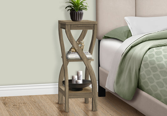 Rustic brown wood accent table with crisscross legs and decorative items