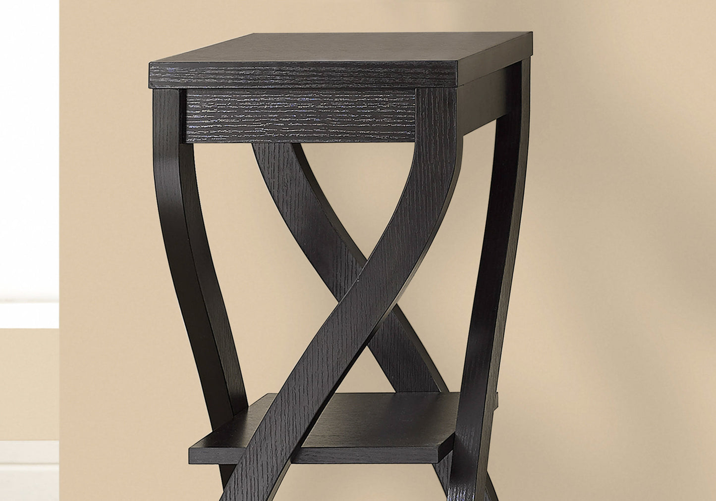 Black wooden side table with crisscross leg design