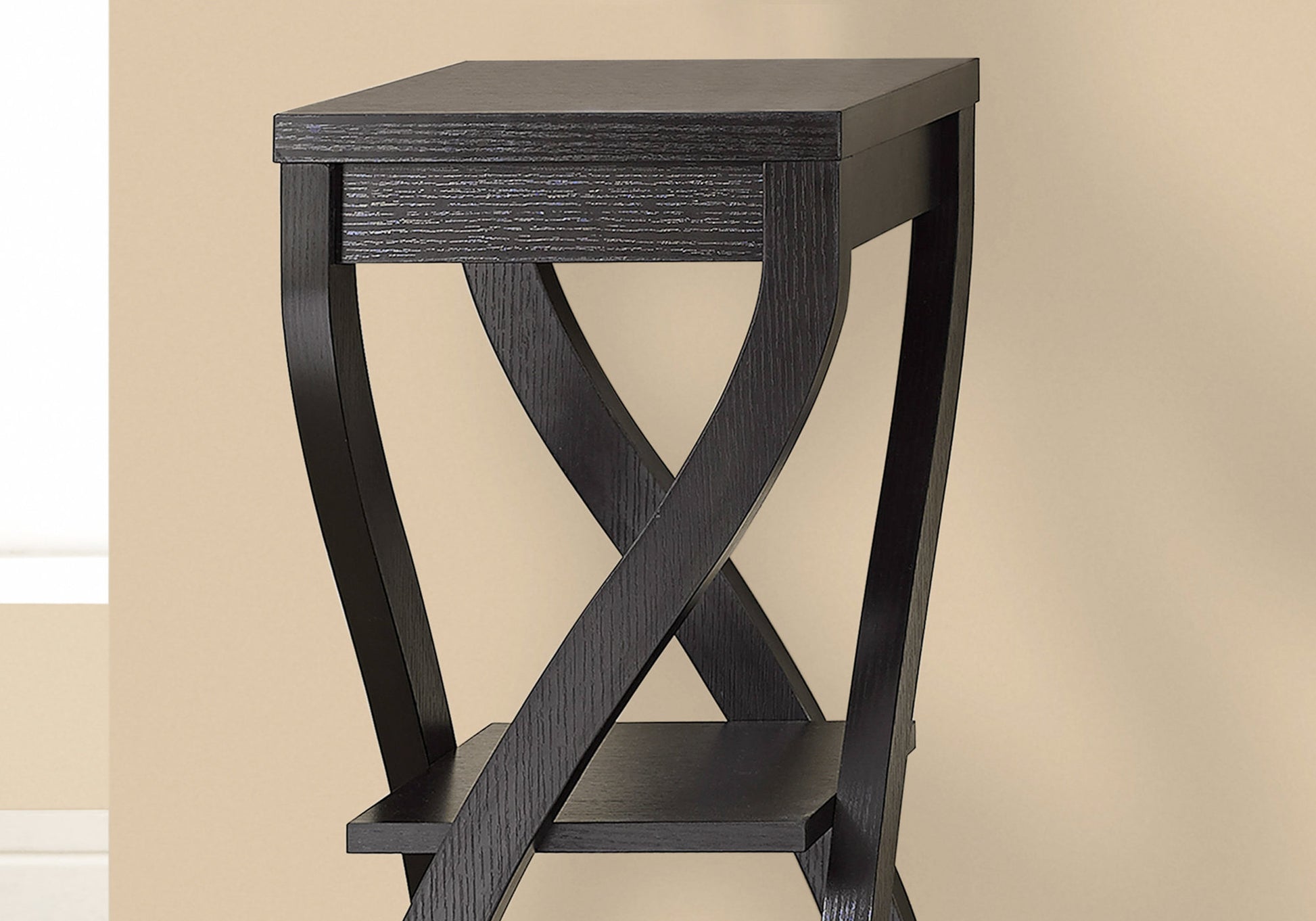 Black wooden side table with crisscross leg design