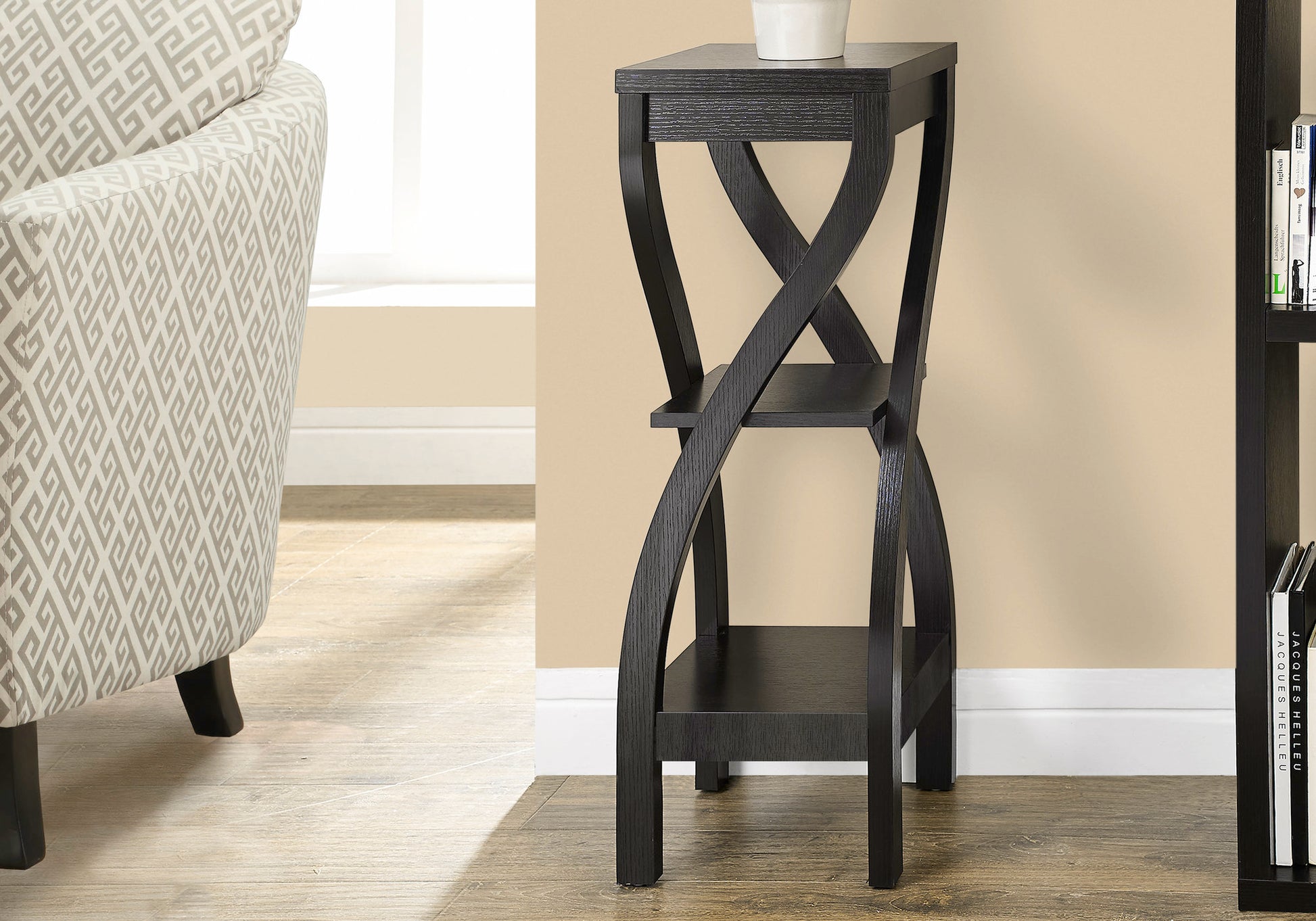 Black distressed wood accent table with two shelves and twisted legs