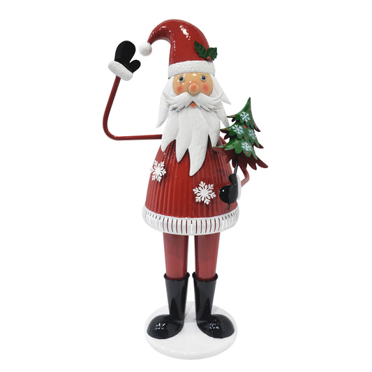 Red metal Santa Claus decoration holding a green Christmas tree perfect for holiday decor