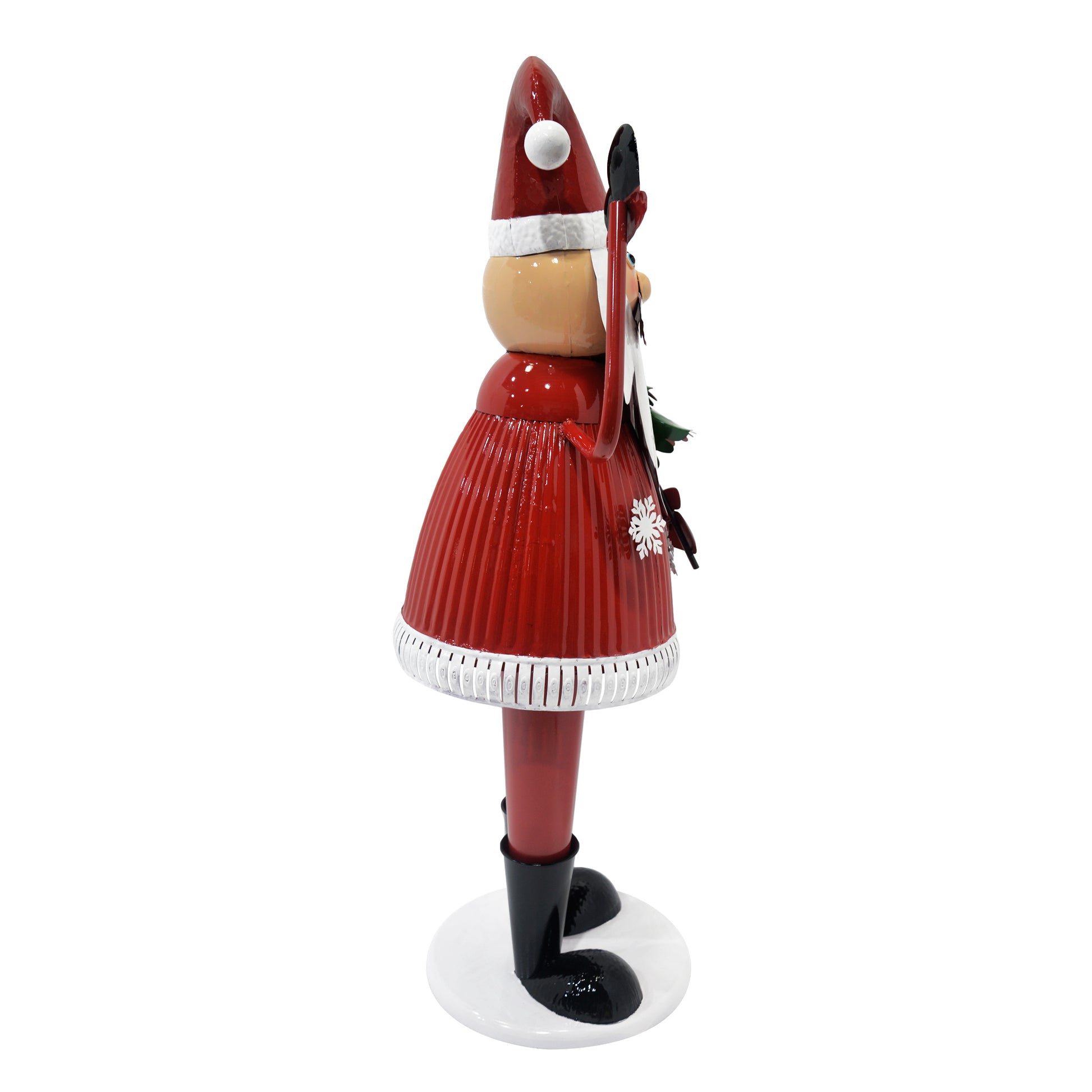 Nutcracker with red pleated skirt and Santa hat holding ski equipment