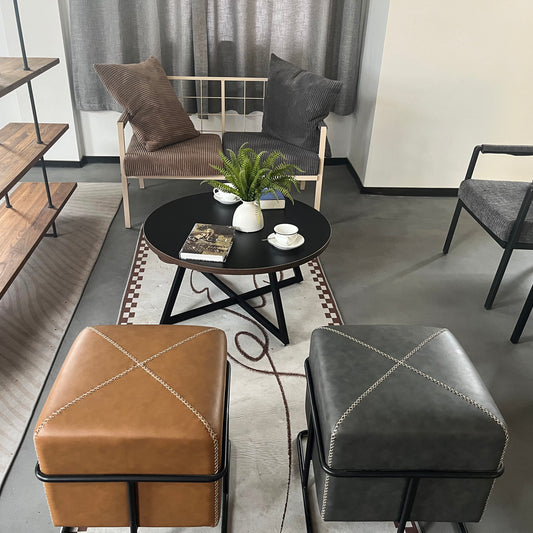 Brown leather square ottoman with white stitching and black metal frame modern accent furniture