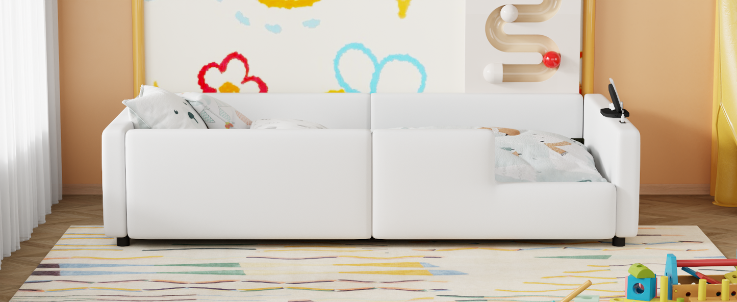 White upholstered sofa with patterned pillows and integrated charging ports