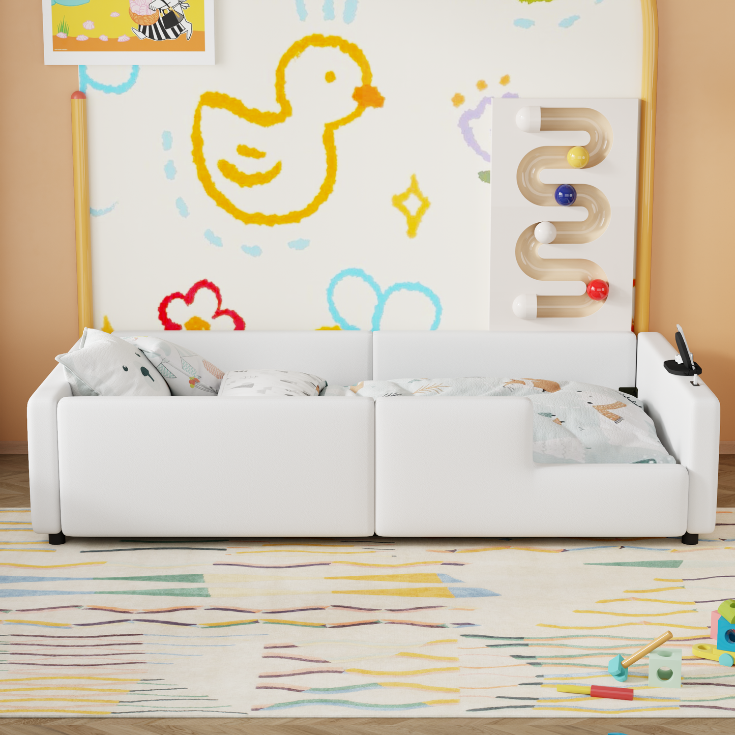 White leather convertible sofa with playful childrens bedding and cartoon wall art
