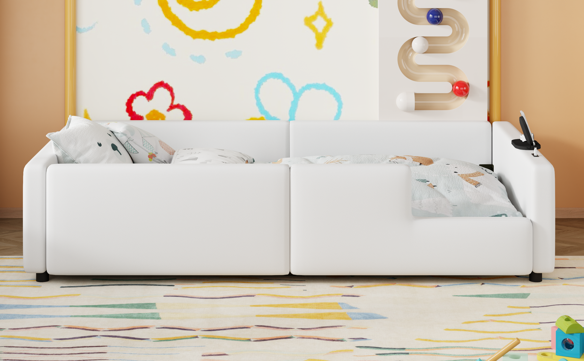 White futon sofa with playful pillows and colorful rug perfect for a childs room