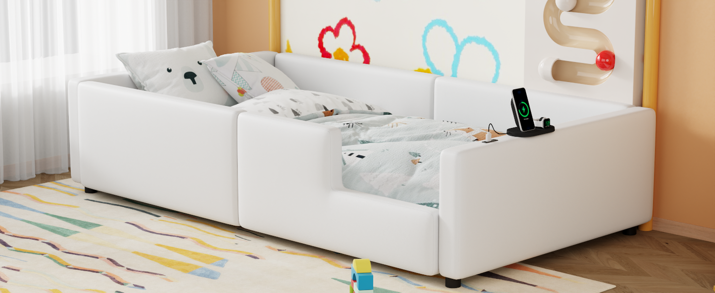 White upholstered toddler bed with protective side rails and playful bedding